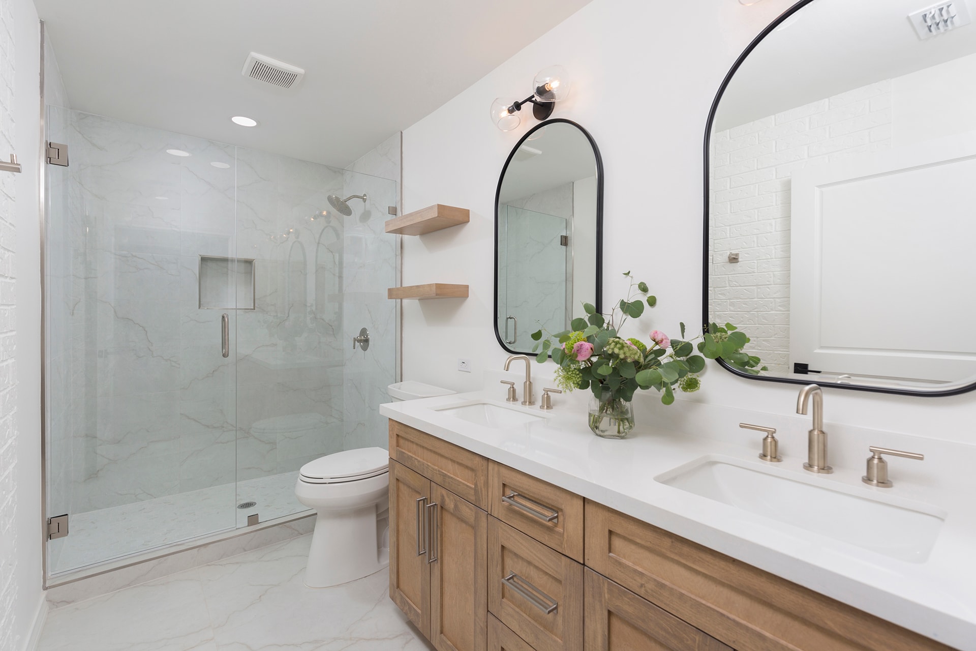 Modern bathroom with double vanity and shower