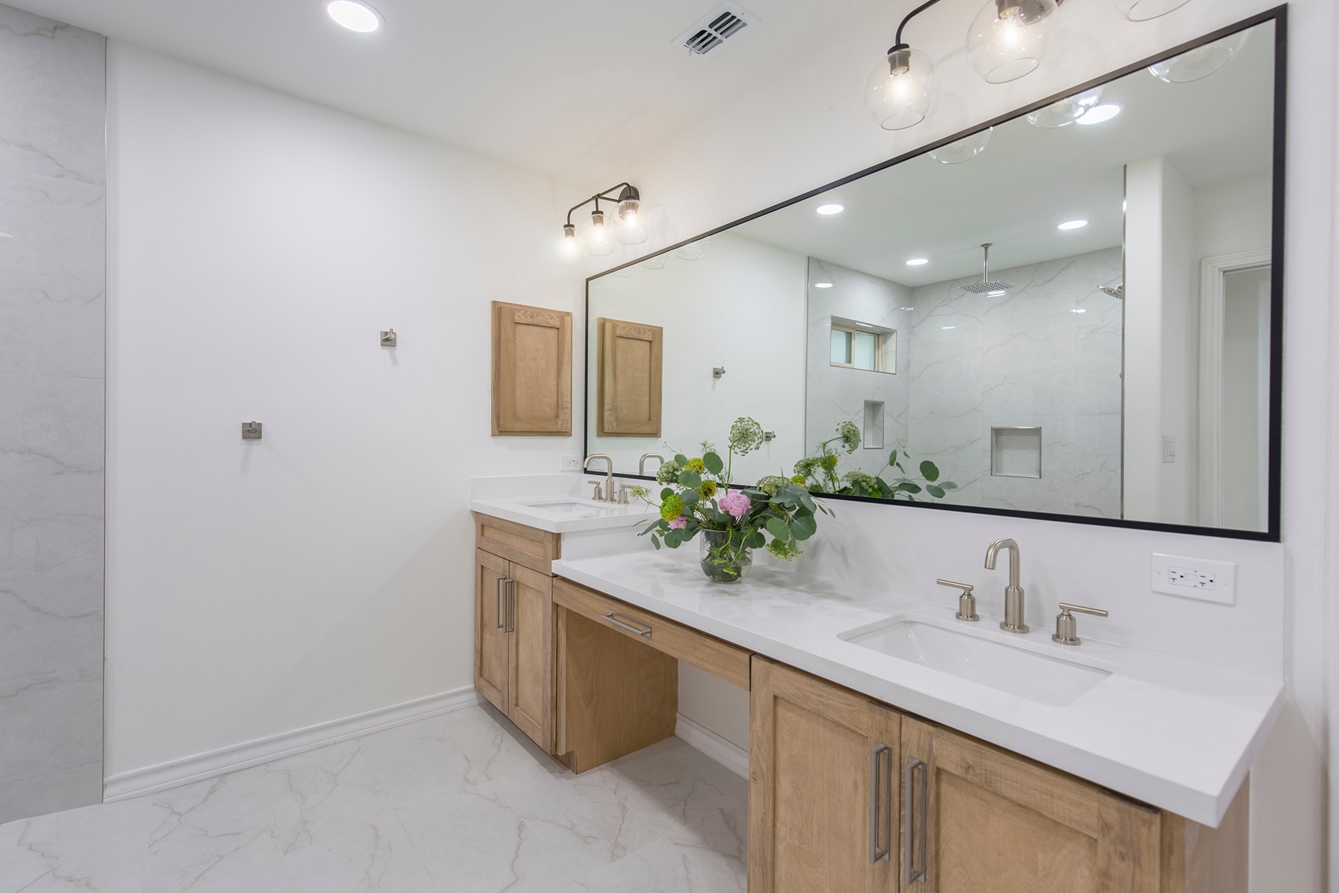 Modern bathroom with double vanity and marble