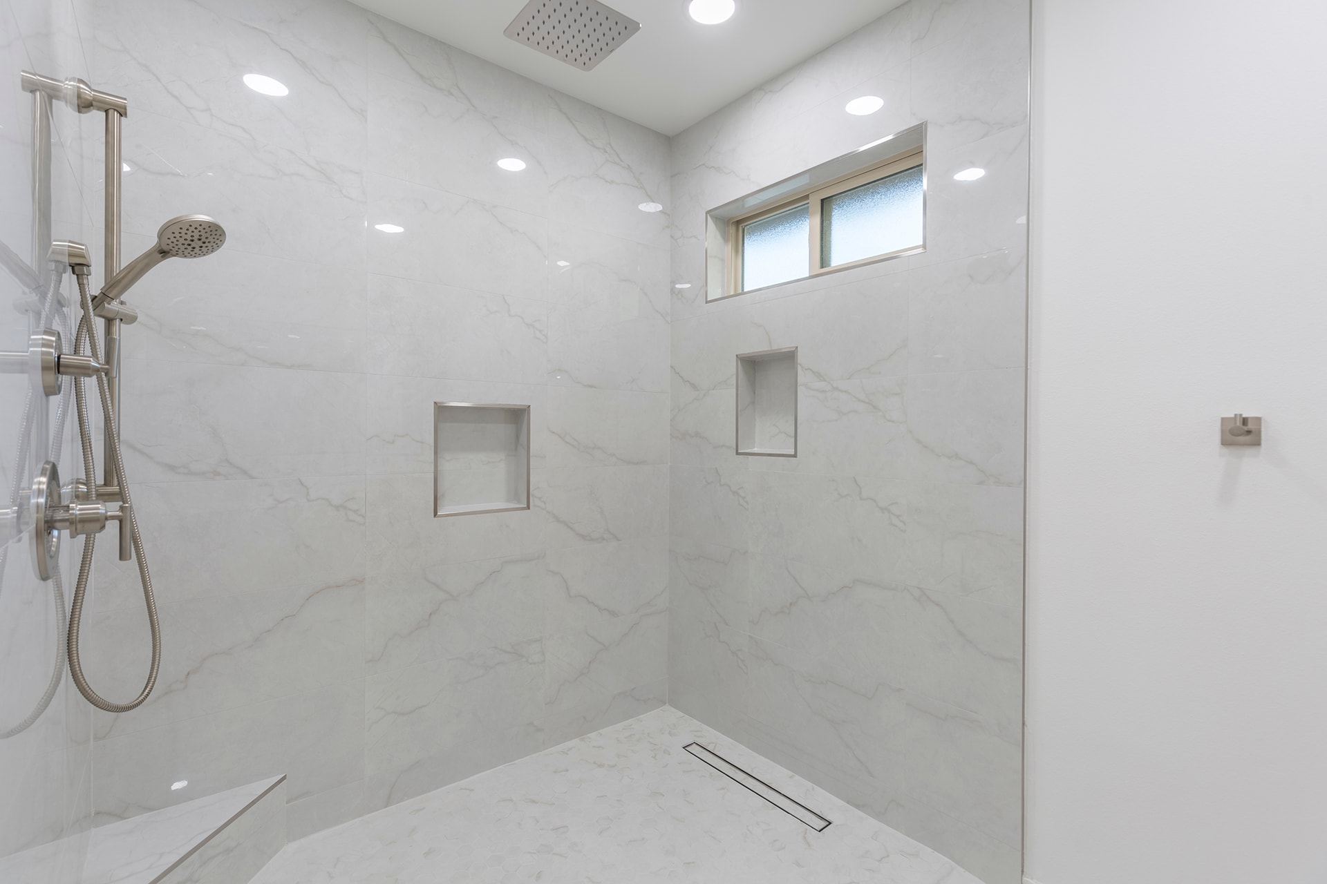 Modern marble walk-in shower with rainfall head