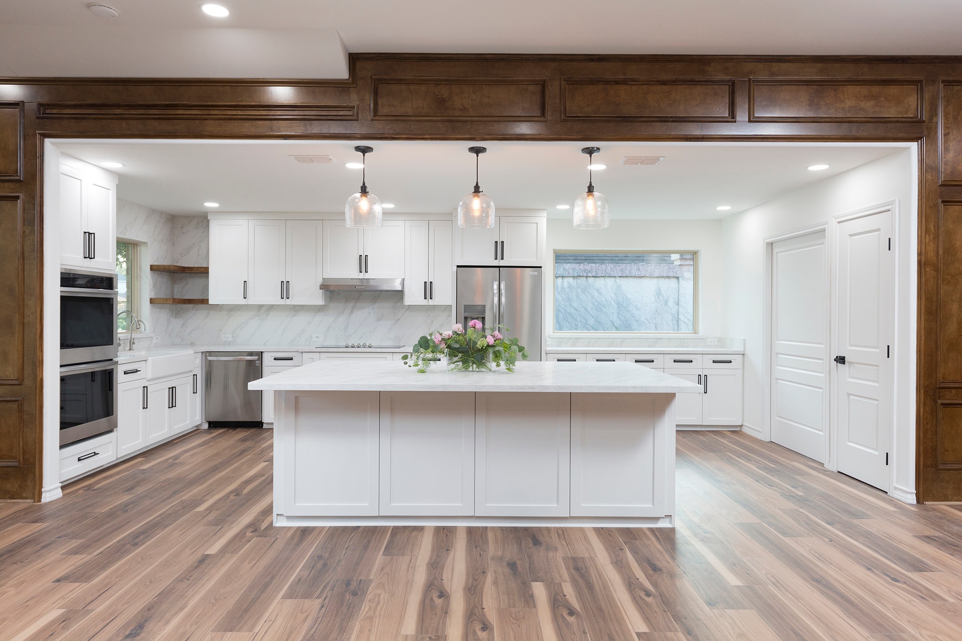 Modern white kitchen with marble island