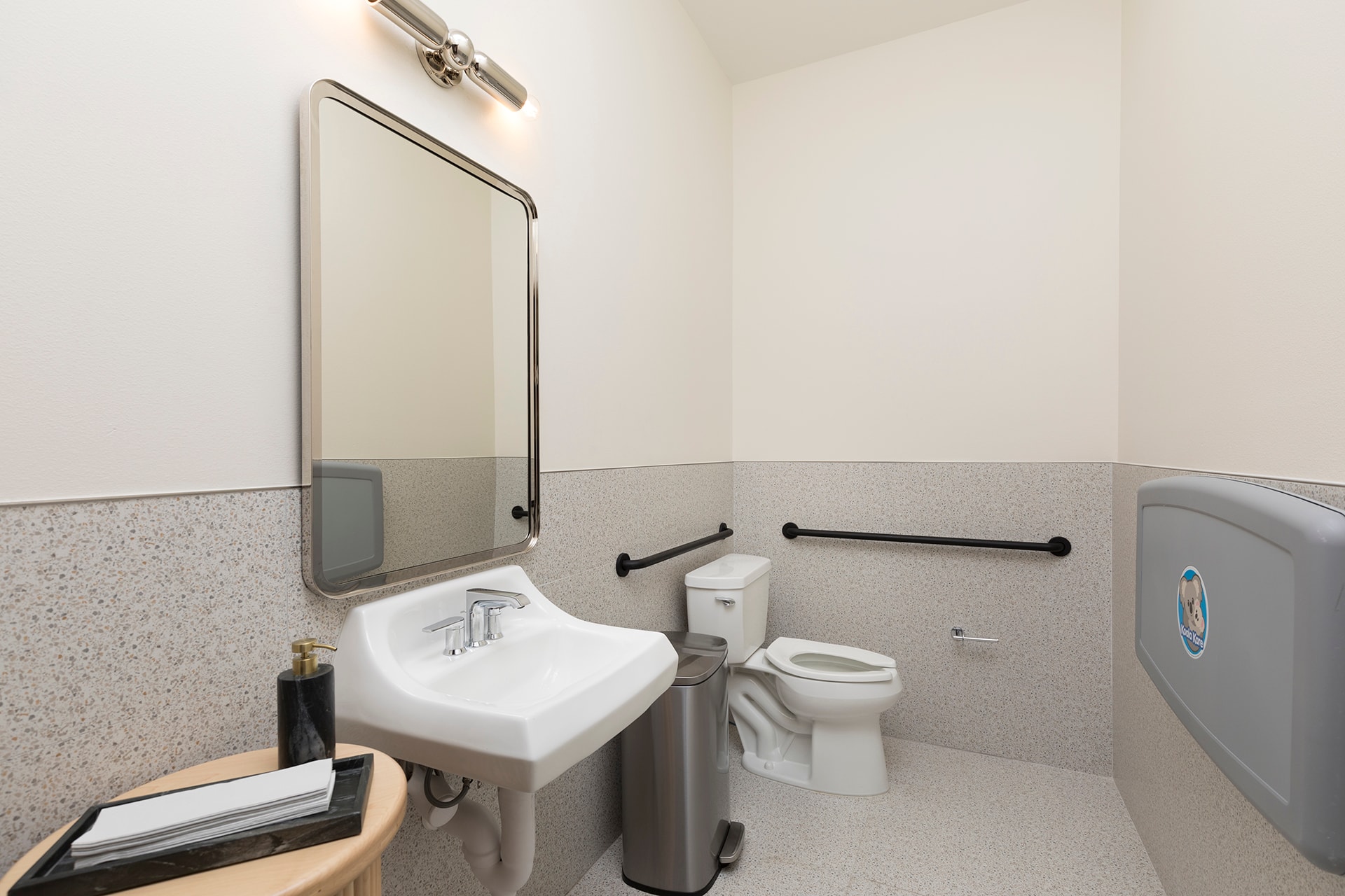 Modern bathroom with sink toilet mirror