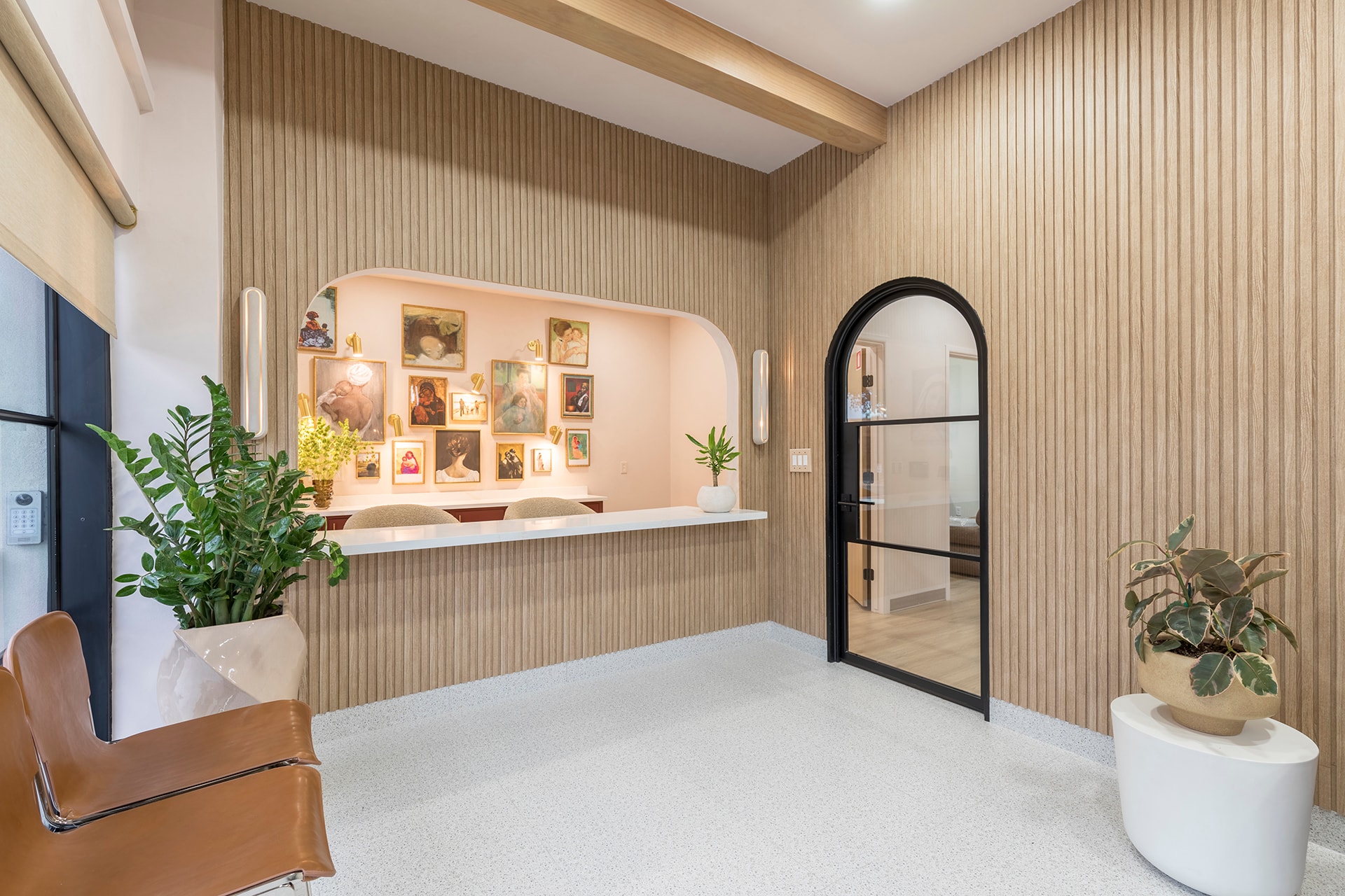 Modern spa reception area with gallery wall
