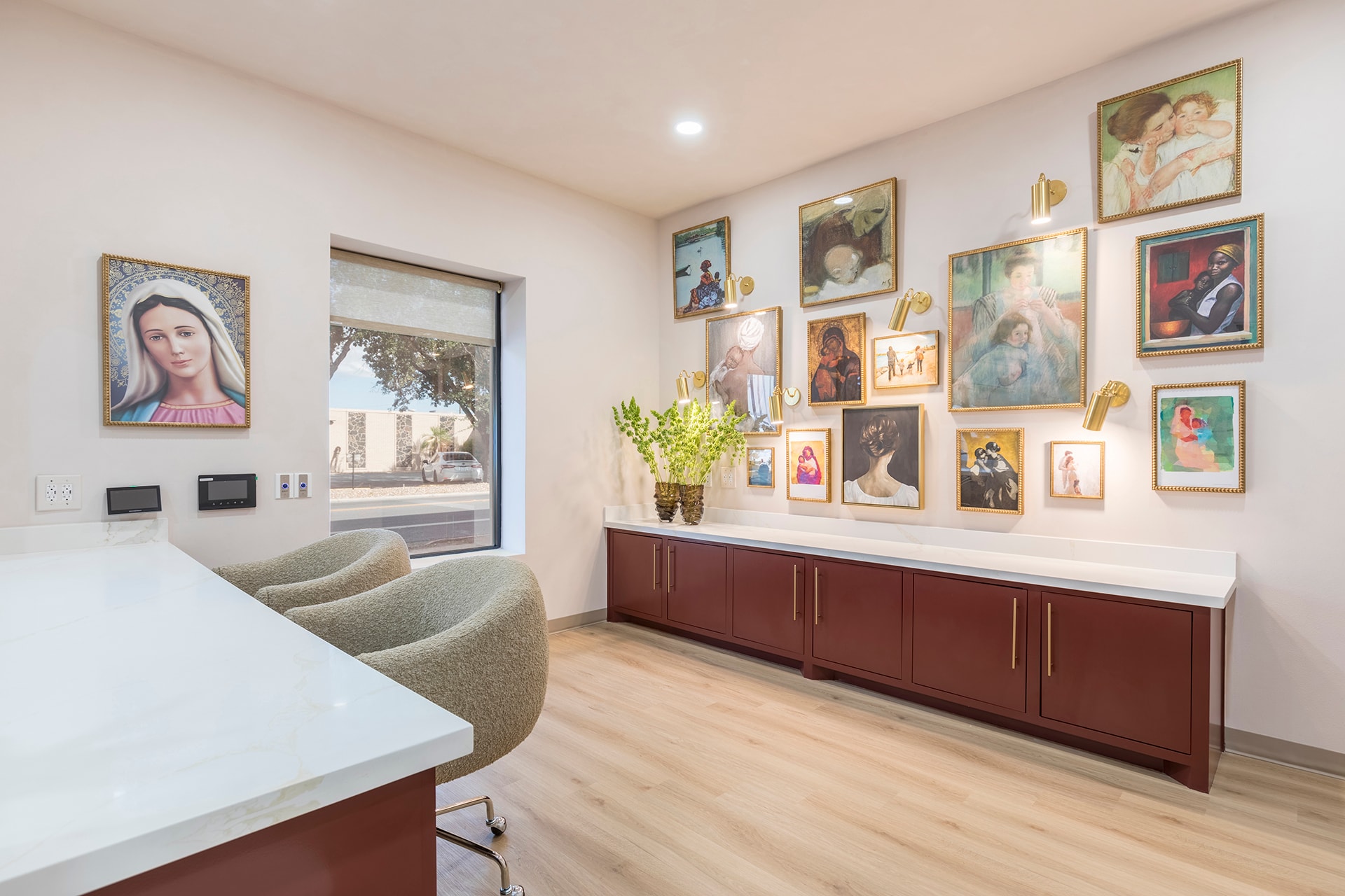 Modern office gallery wall with portrait art