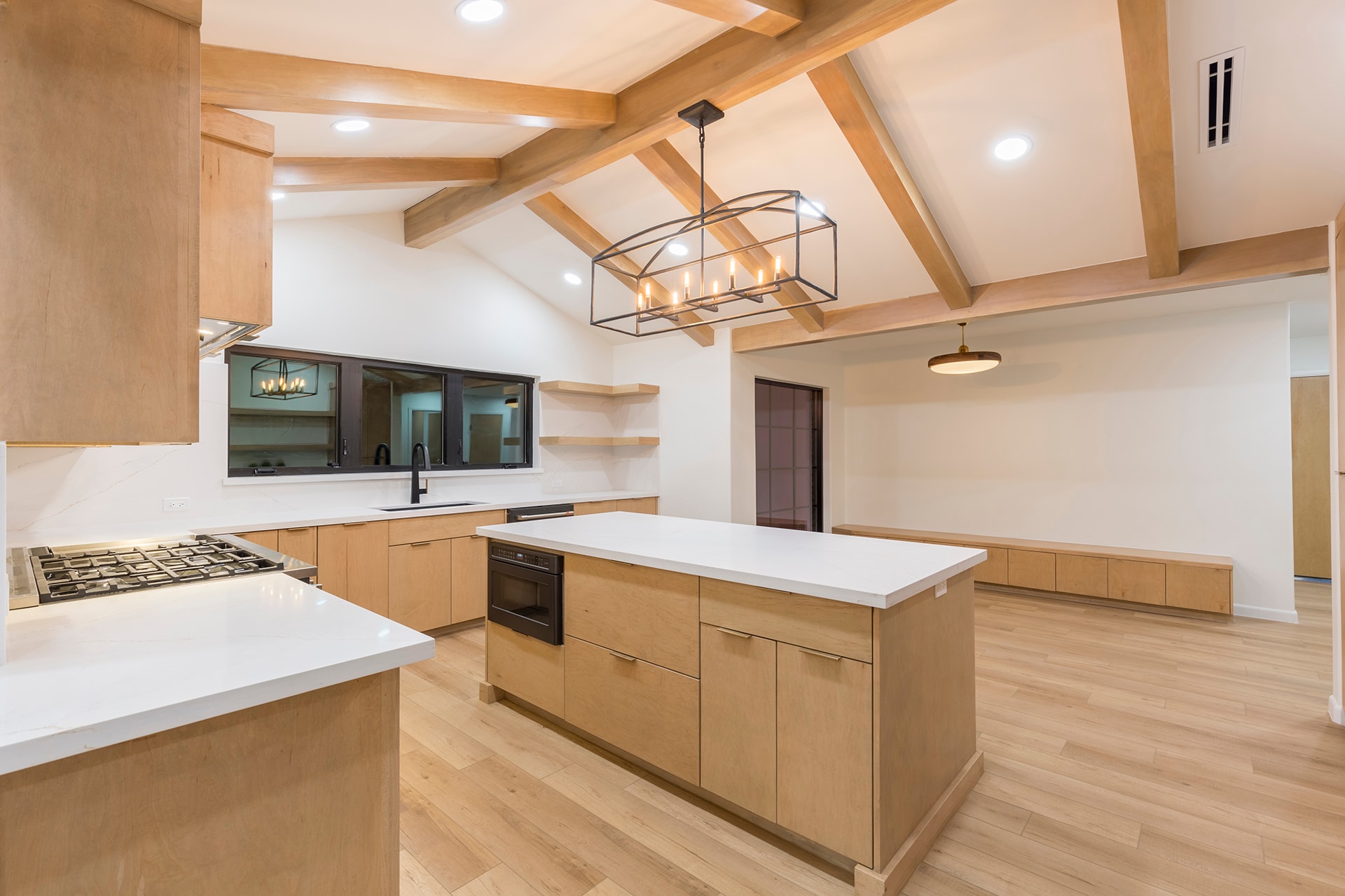 Modern kitchen with wood beams and island