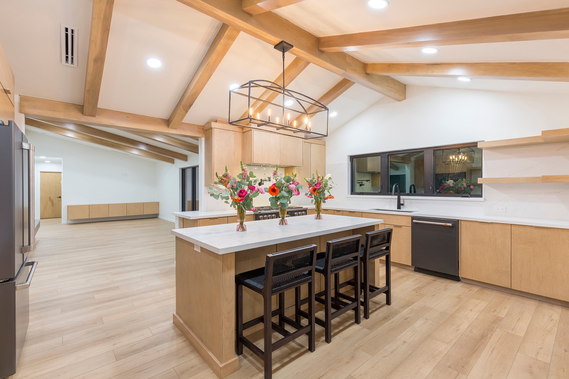 Modern kitchen with wood beams and island