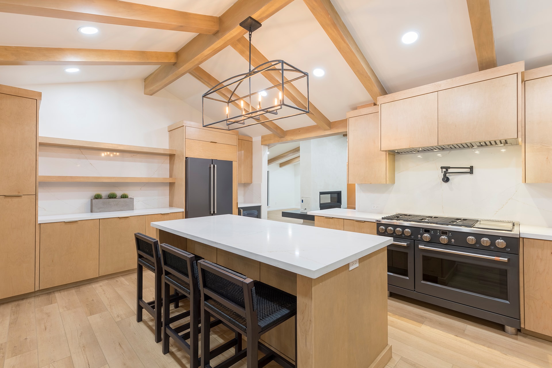 Modern kitchen with wood beams island