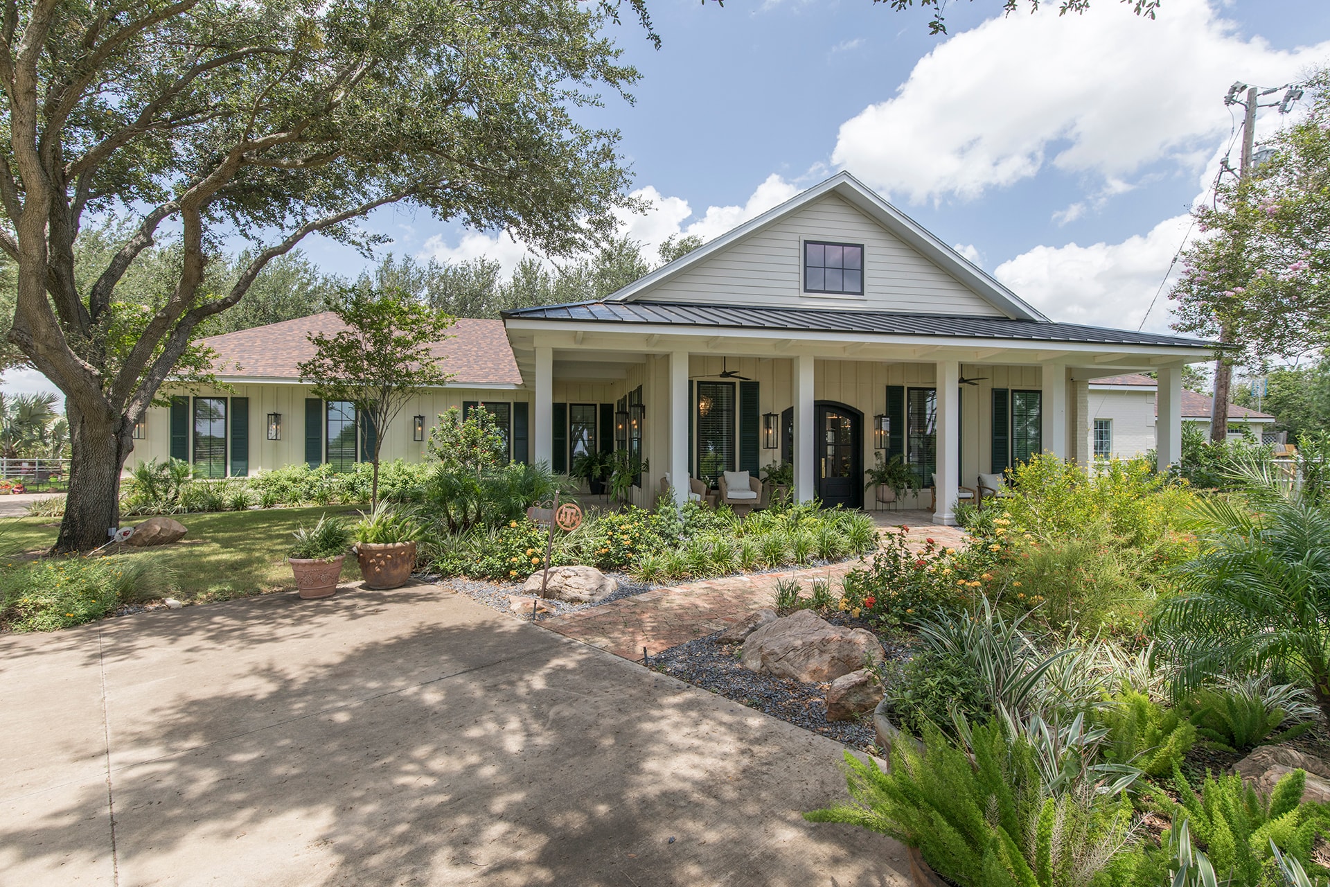 Modern farmhouse with front porch landscaping