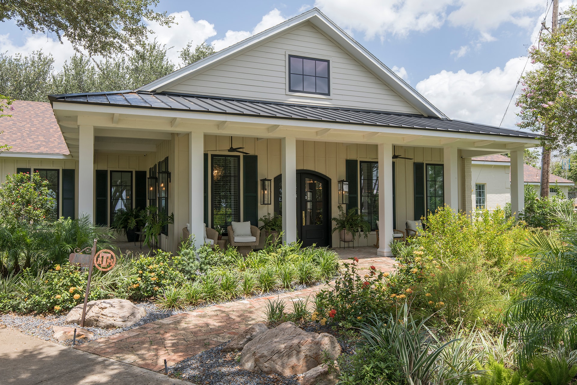 Modern farmhouse with front porch landscaping
