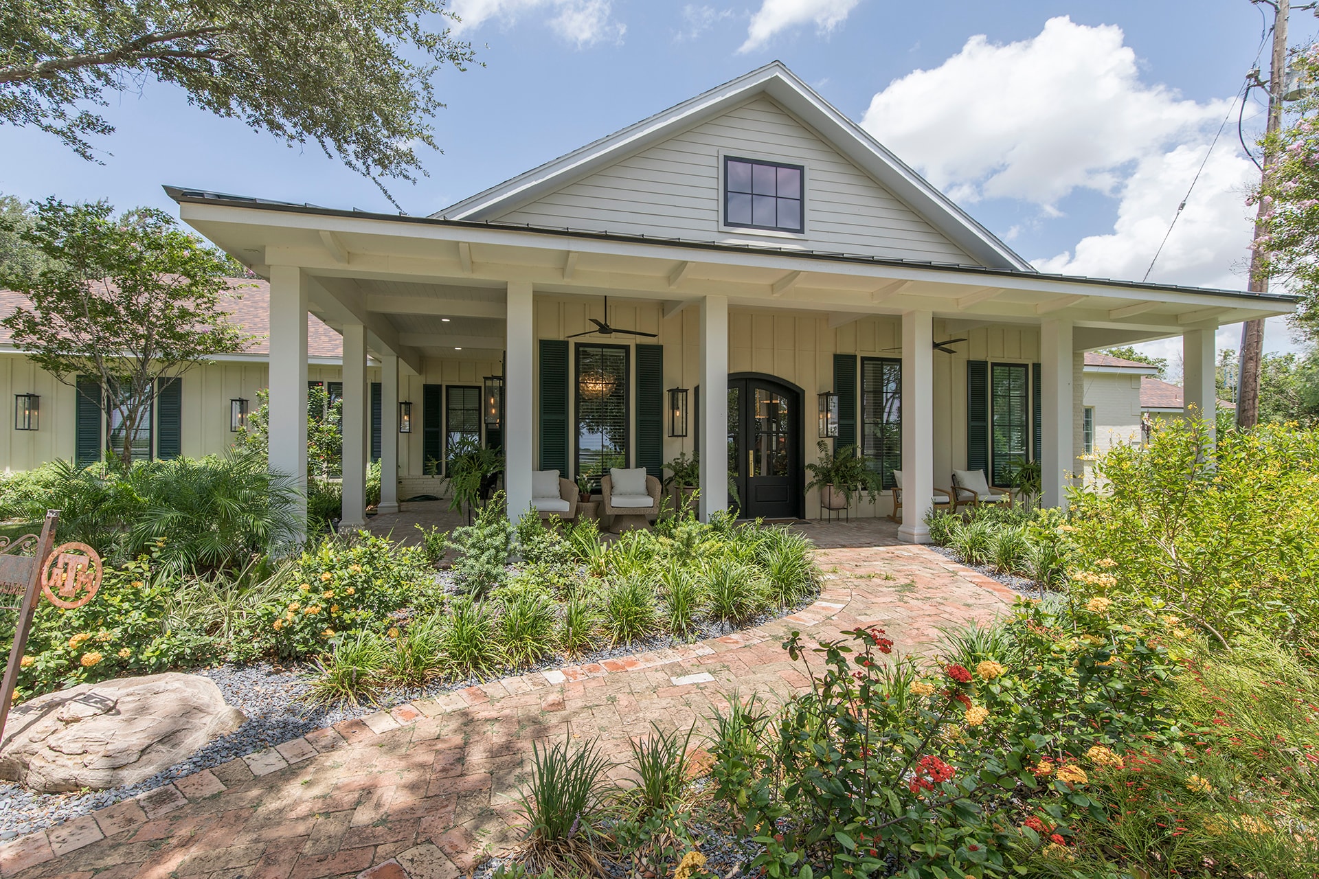 Modern farmhouse with front porch landscaping