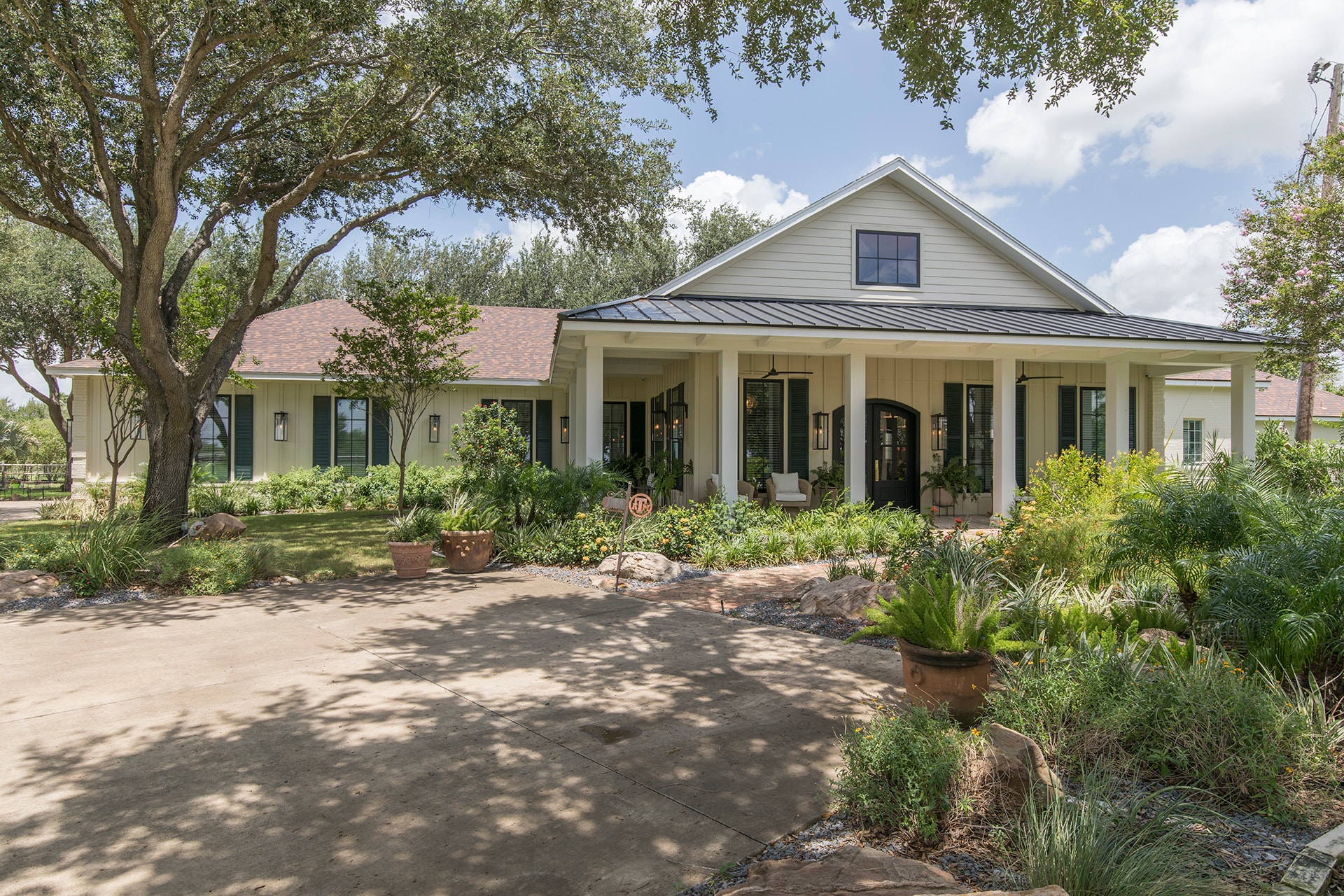 Modern farmhouse with front porch landscaping