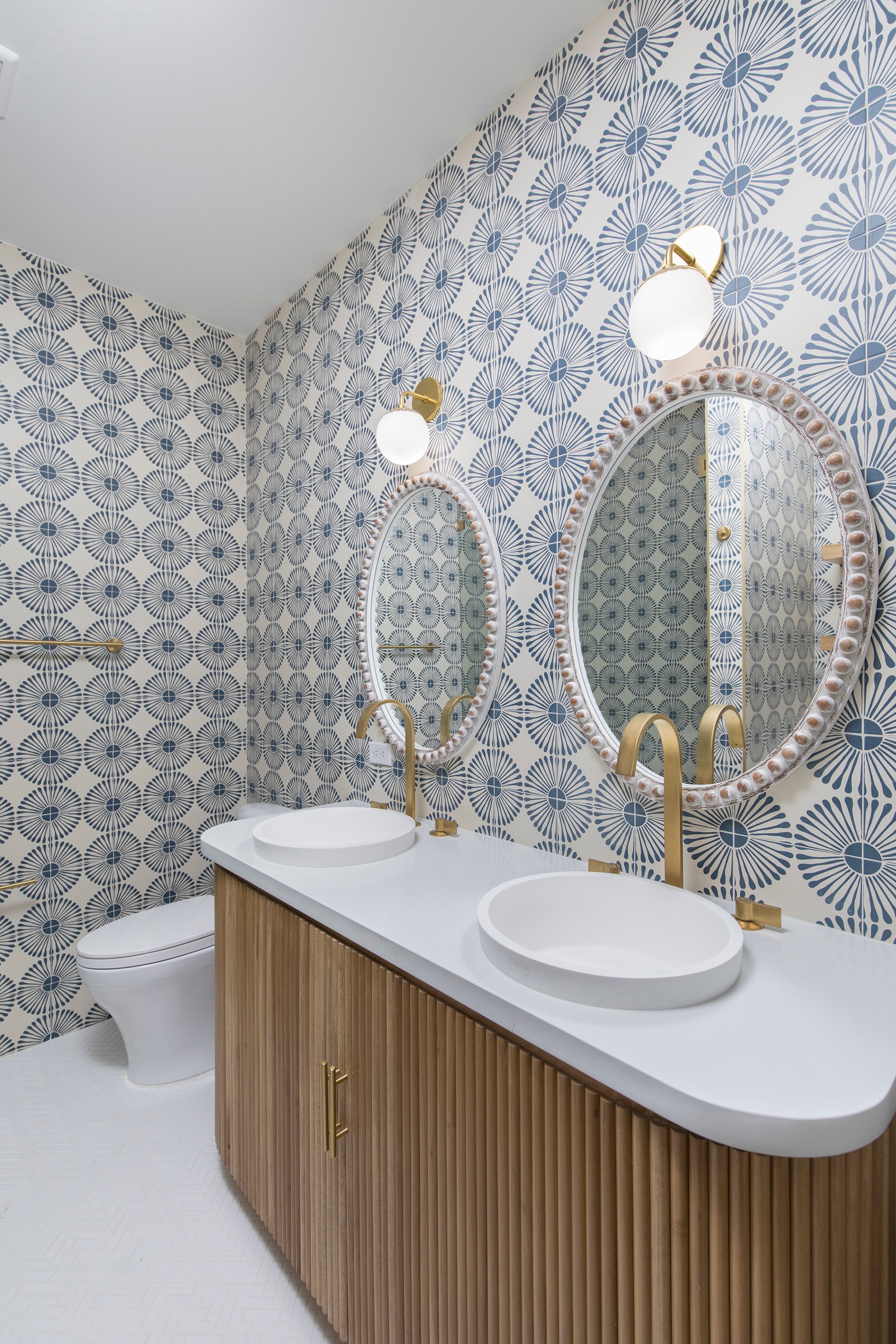 Modern bathroom with patterned wallpaper double sink