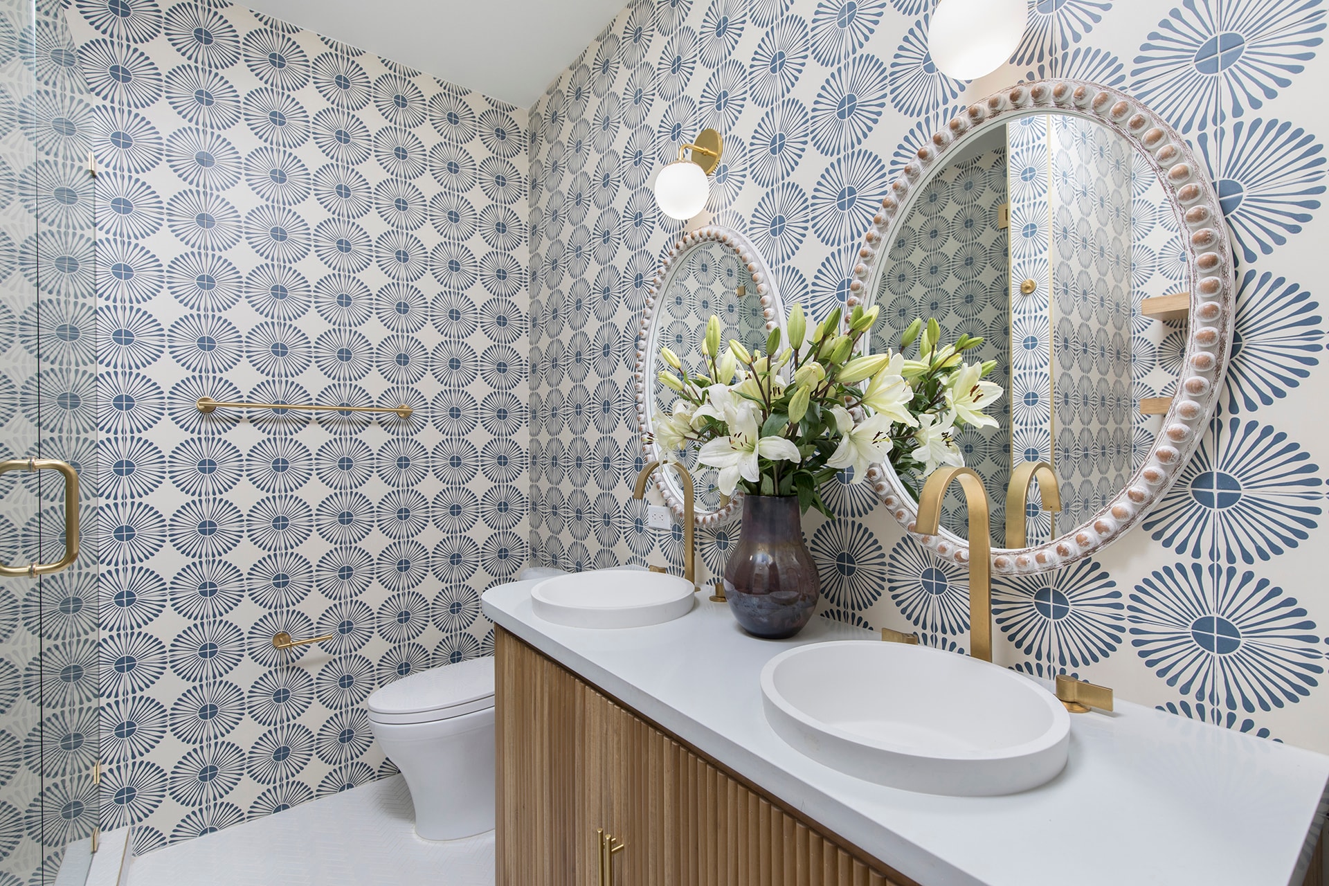 Modern bathroom with patterned wallpaper and flowers
