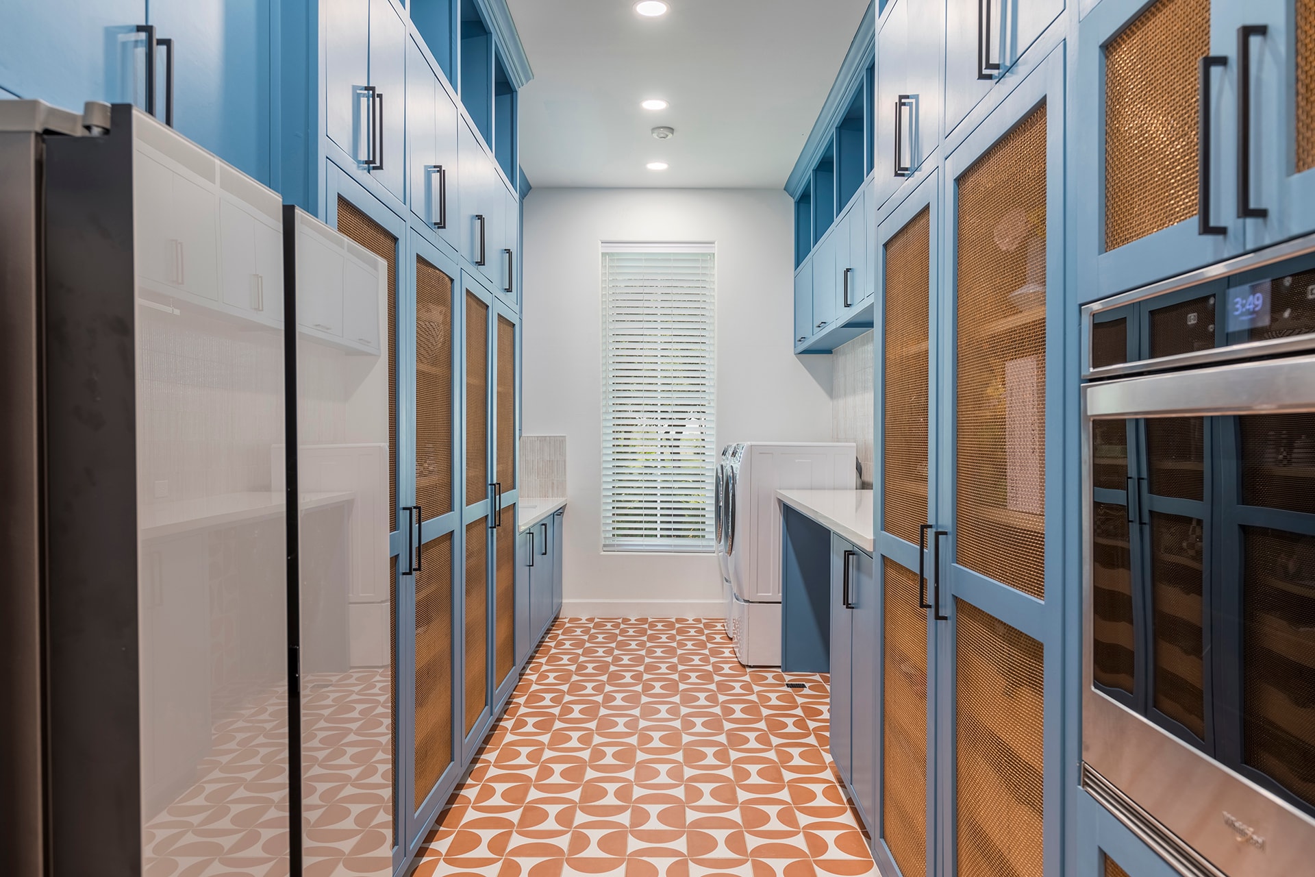 Modern kitchen with blue cabinetry and appliances